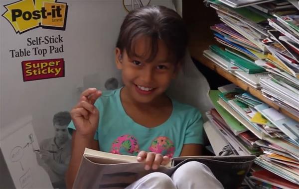 young girl using ASL 